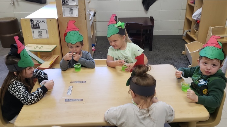 Ms. Newby's and Mrs. Austin's Pre-K class celebrated National Grinch Day.  They had green snacks, made grinch crafts, and listened to "How the Grinch Stole Christmas".